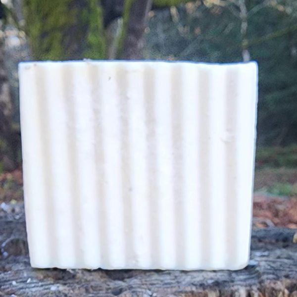 unscented goat milk soap on a stump