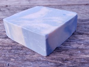 honeysuckle goat milk soap bar on wood