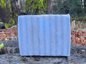 aloha spirit goat milk soap bar on a stump