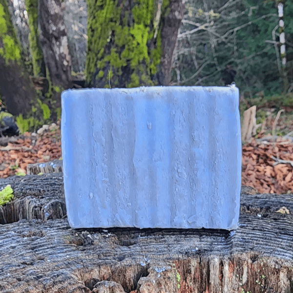 aloha spirit goat milk soap bar on a stump