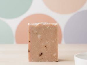 hippie love goat milk soap with pastel polka dot background